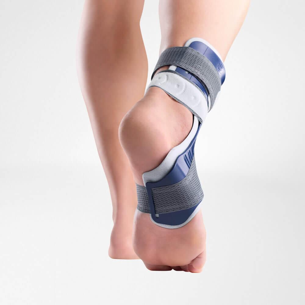 Model wearing the Bauerfeind MalleoLoc L Ankle Support while walking pictured from below