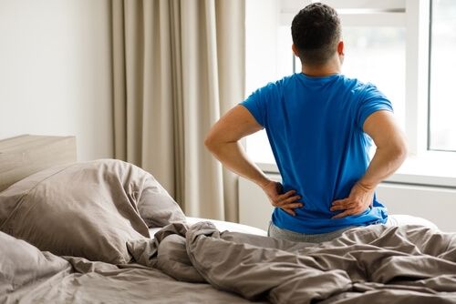 what to do for back pain after sleeping