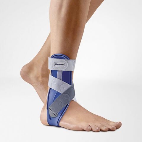 Person wearing the Bauerfeind MalleoLoc Ankle Support on the right ankle