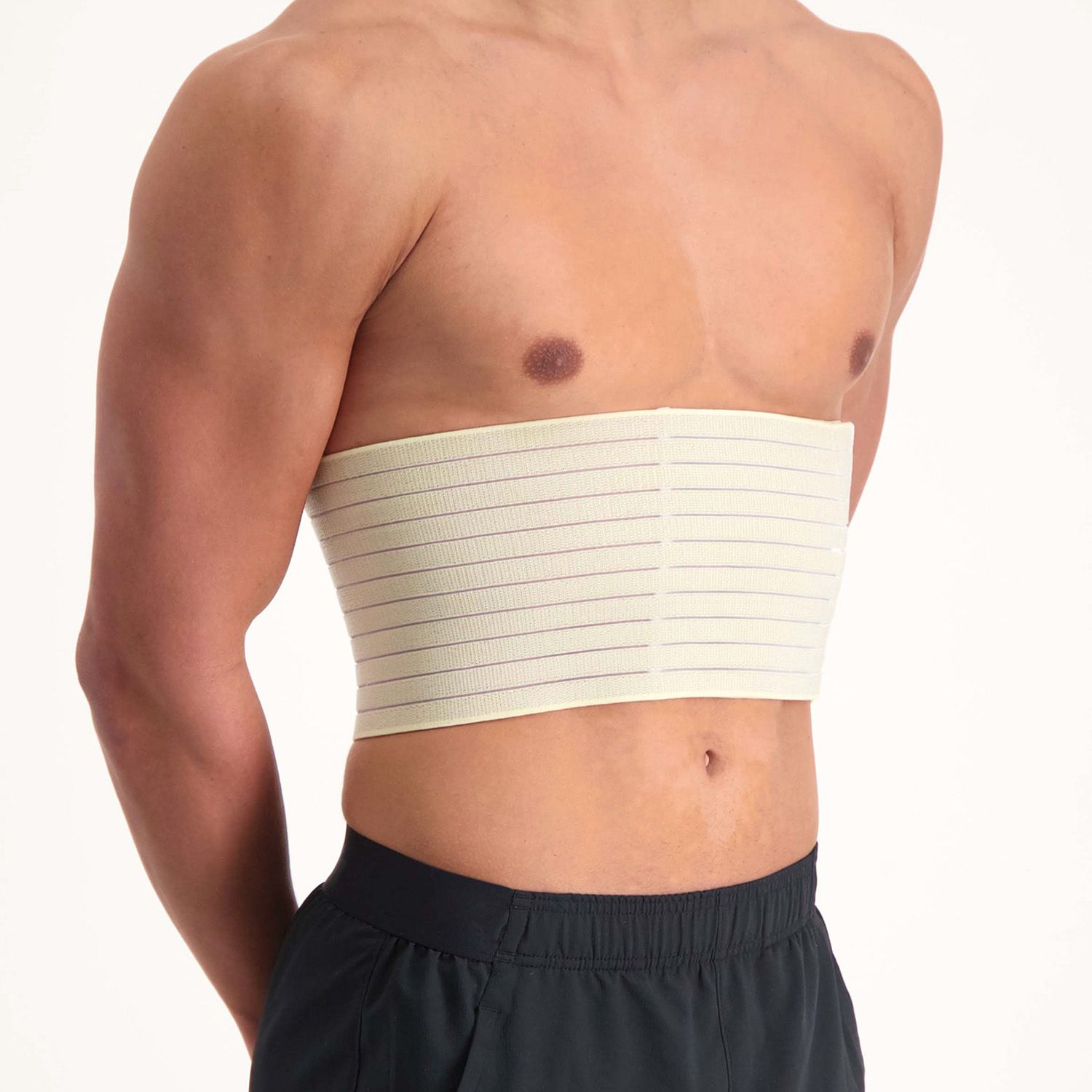 Side view of male model wearing the Dunimed Rib Support