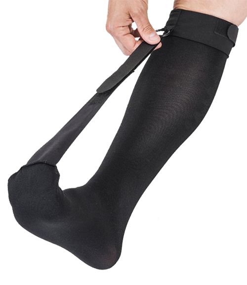 Heel Spur Sock - Night Splint worn by model with the strap of the sock lifting the toes up