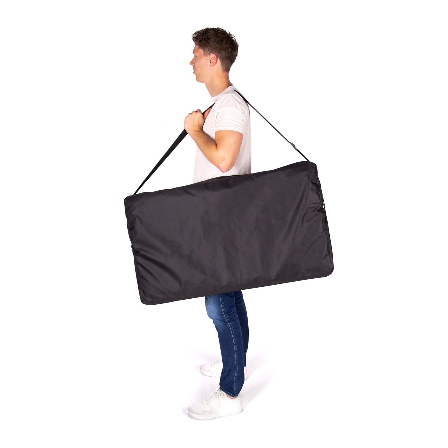 Dunimed Massage Table - Wooden Frame being carried by model in the carry-on bag