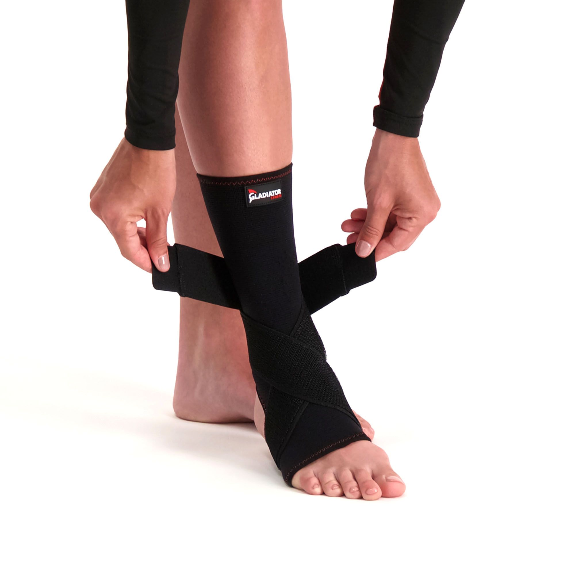Both straps of the Gladiator Sports Premium Ankle Support being tightened