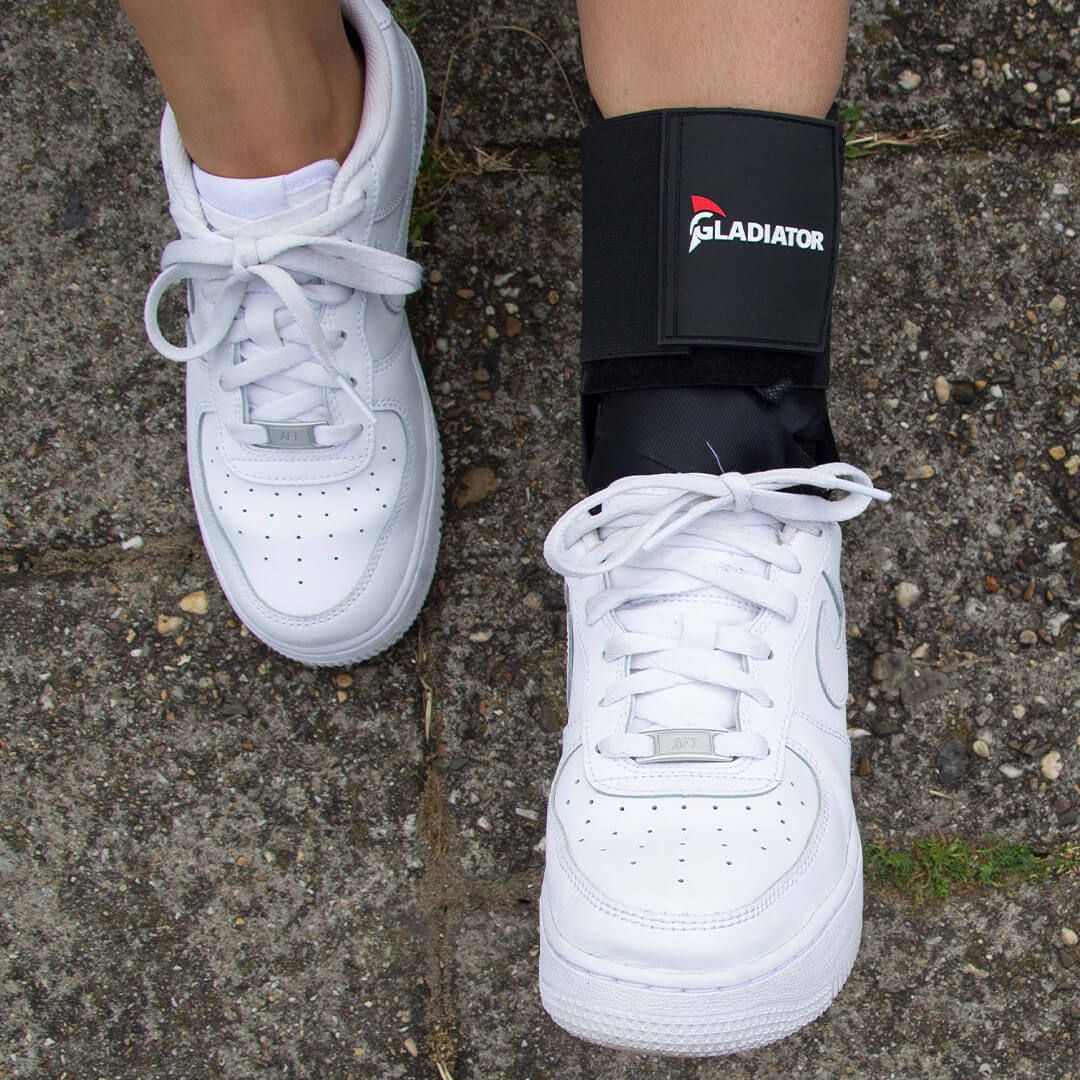 Gladiator Sports Lightweight Ankle Support with Straps worn around the left ankle