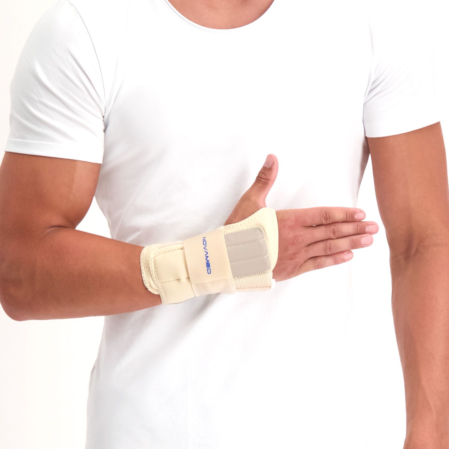 Front view of model wearing the Novamed Lightweight Wrist Support in Beige