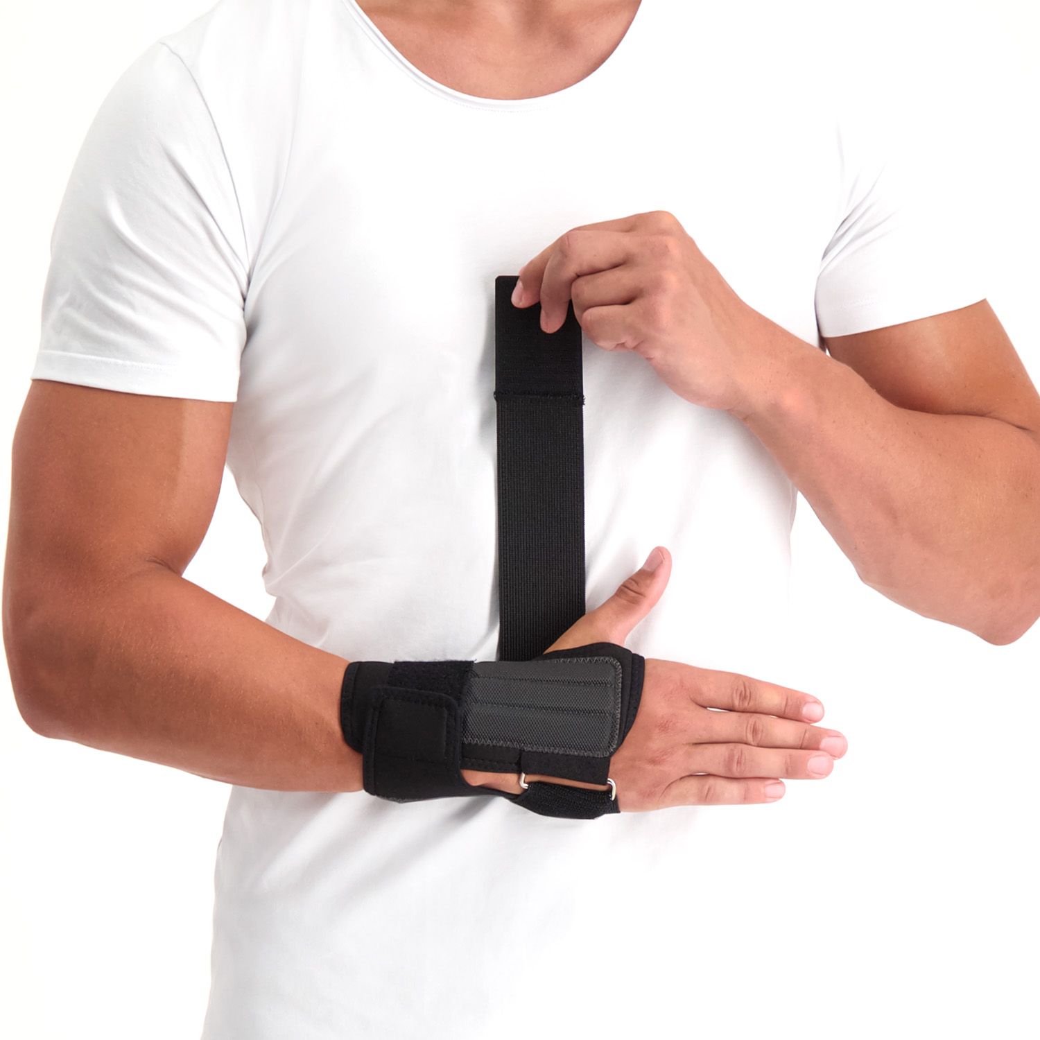 Front view of model strapping the Novamed Lightweight Wrist Support in Black