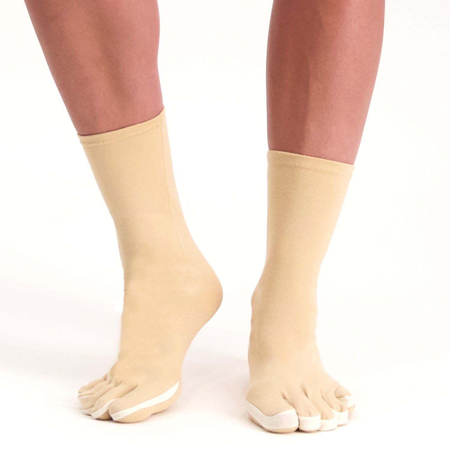 Model wearing the Dunimed Rheumatoid Arthritis / Osteoarthritis Socks in Beige lifting the foot up