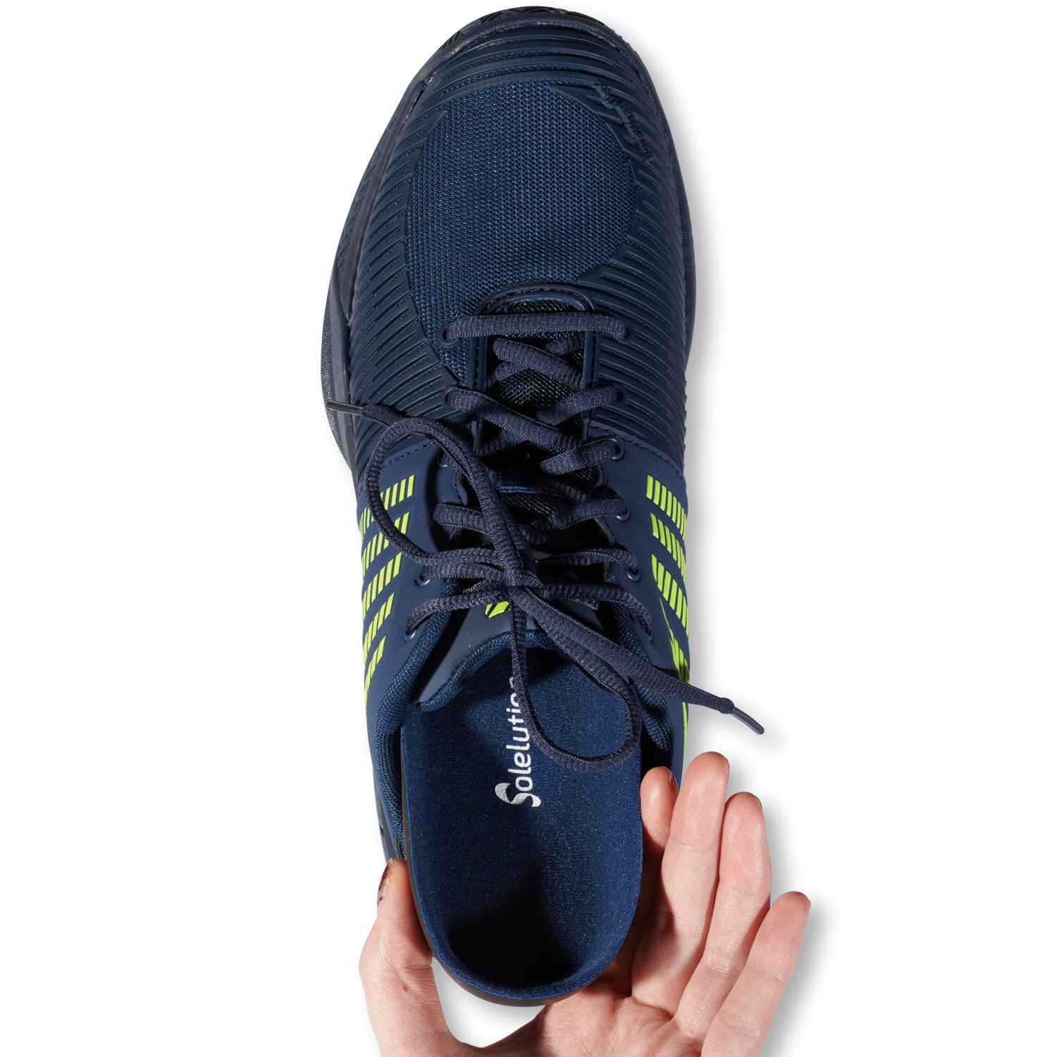 Solelution Flatfoot Insoles being put in sports shoe