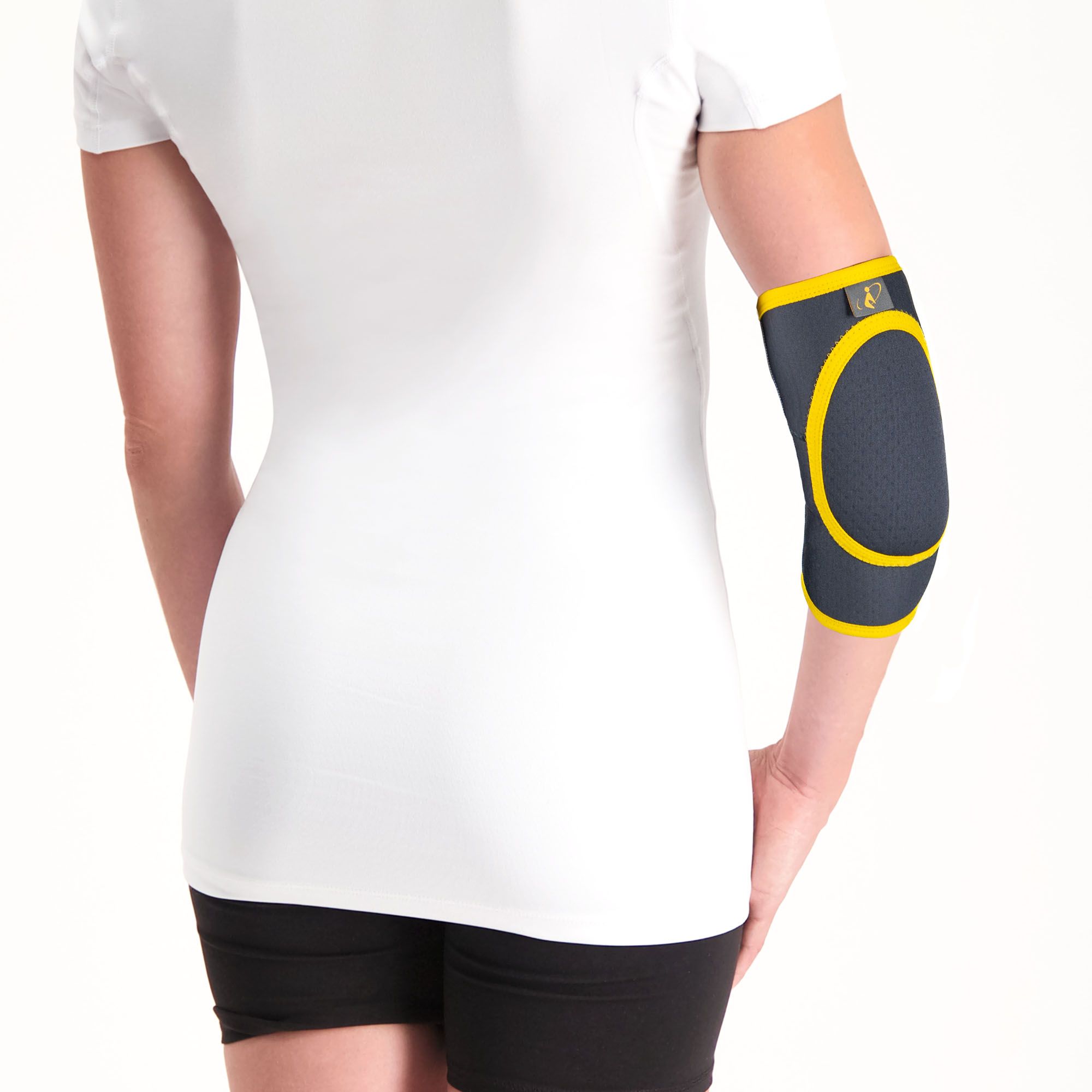 Back view of model wearing the Morsa Elbow Pad around the right elbow