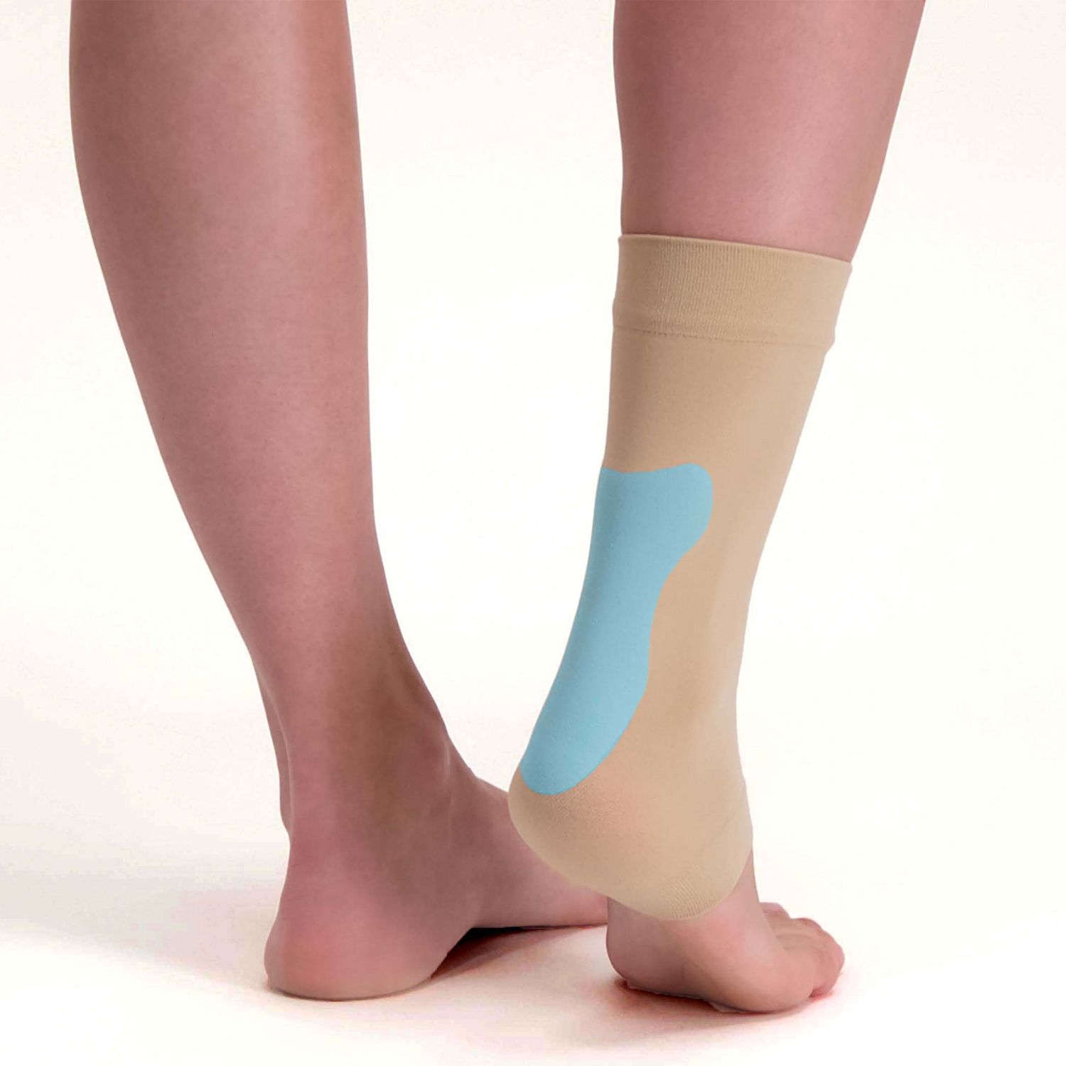 Back view of model wearing the Solelution Achilles Tendon Gel Sock - Beige with the gel cushion pad showing