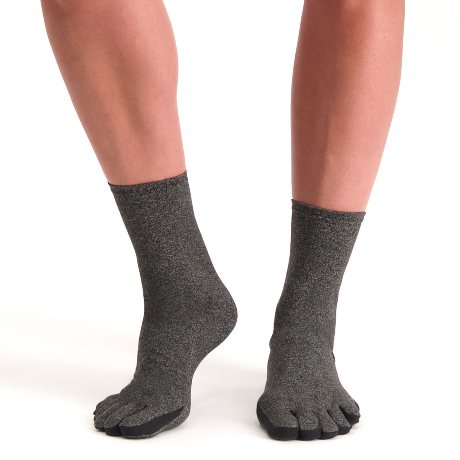 Model wearing the Dunimed Rheumatoid Arthritis / Osteoarthritis Socks in Grey lifting the foot up