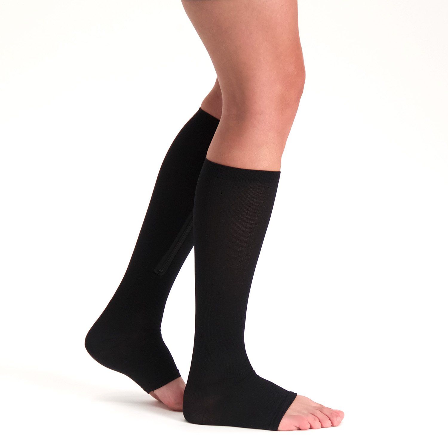 Side view of model wearing the Support Stockings with Zipper - Open Toe - Black on both legs while walking