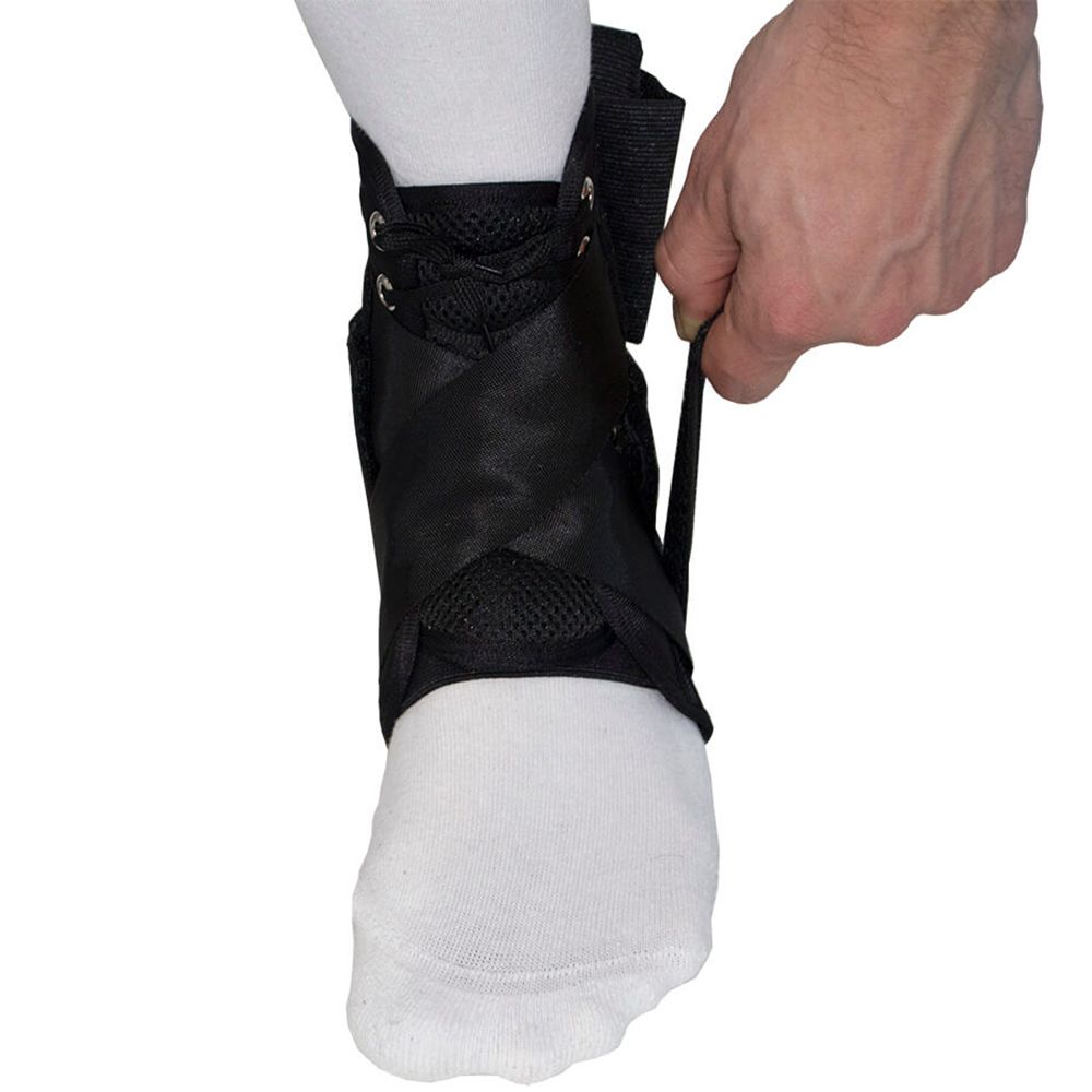 Left side strap of the Gladiator Sports Lightweight Ankle Support with Straps being tightened