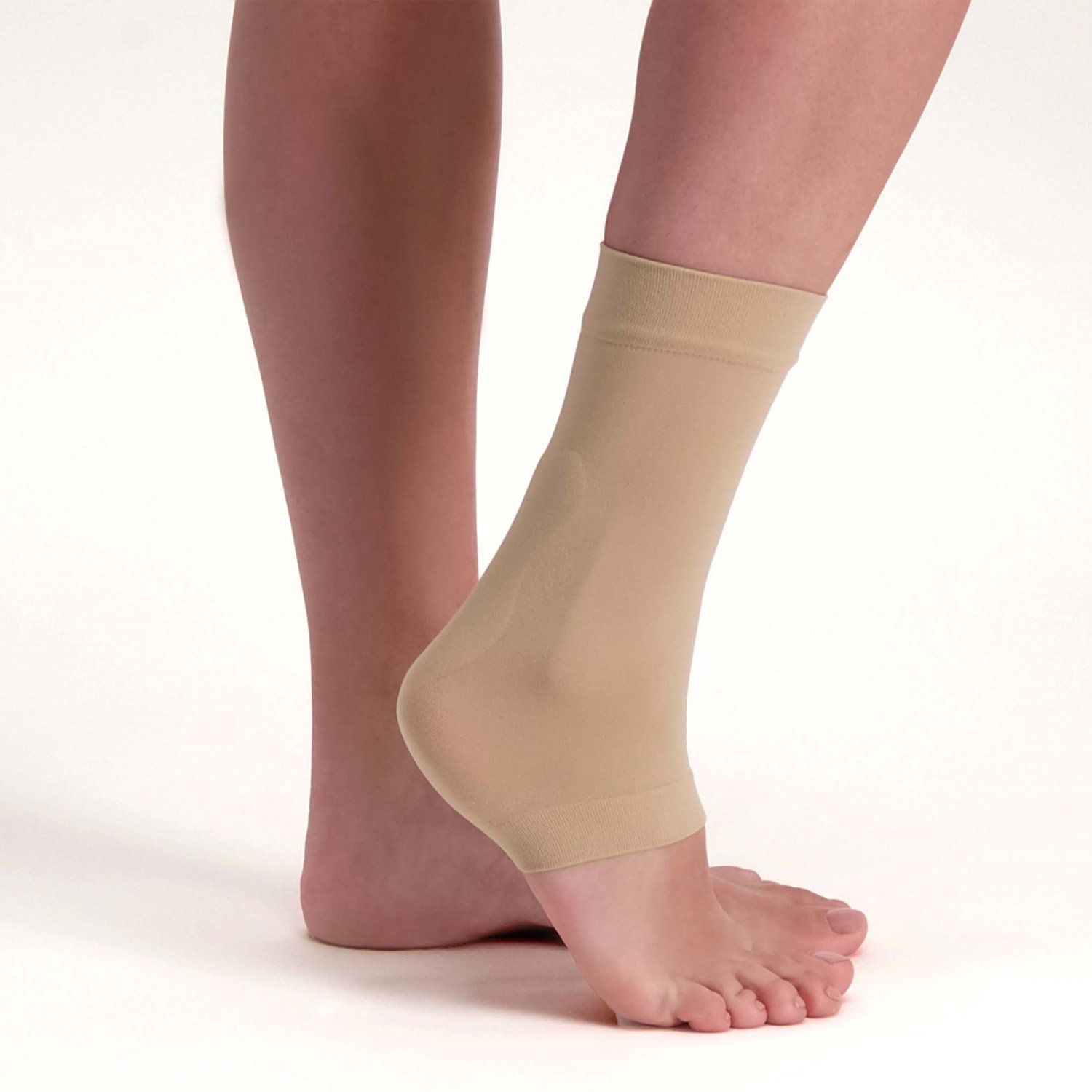 Right side view of model wearing the Solelution Achilles Tendon Gel Sock - Beige around the right ankle
