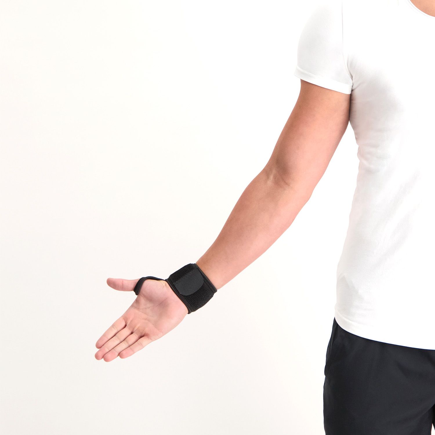 Model stretching out his arm and hand while wearing the Dunimed Wrist Support