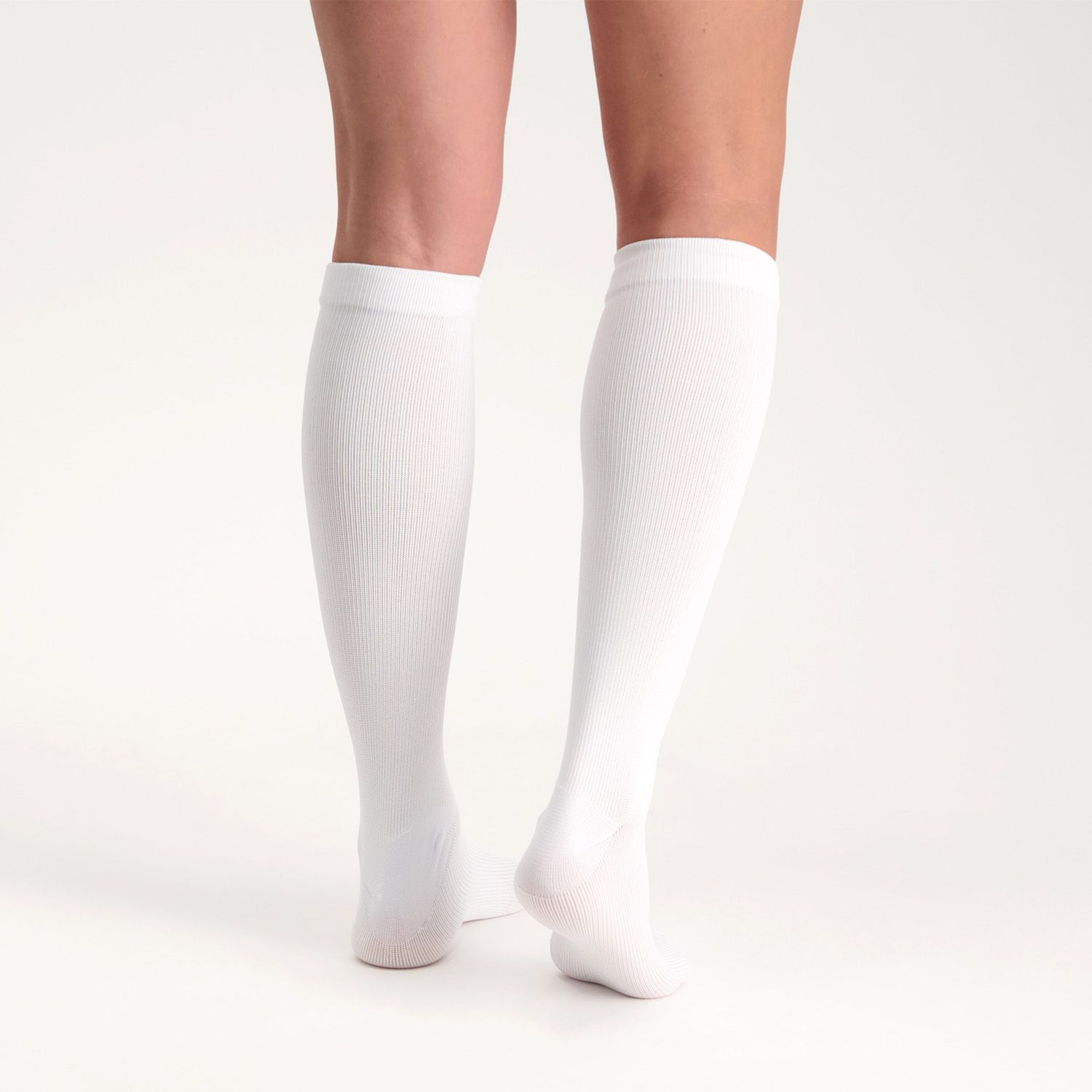 Back view of model wearing the Support Stockings / Travel Stockings - Closed Toe - White