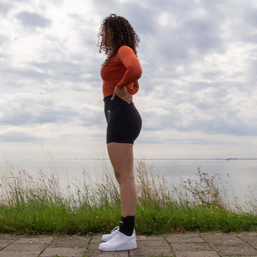 Model wearing the Gladiator Sports Lightweight Ankle Support with Straps while running