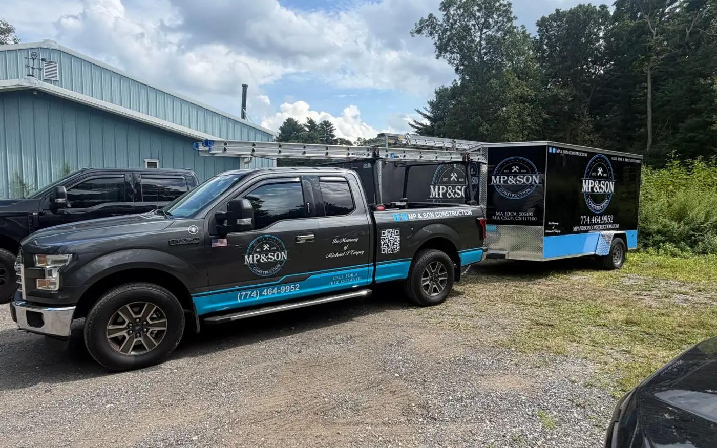 MP & Son Construction pickup and enclosed trailer wrapped in the company's black and blue branding