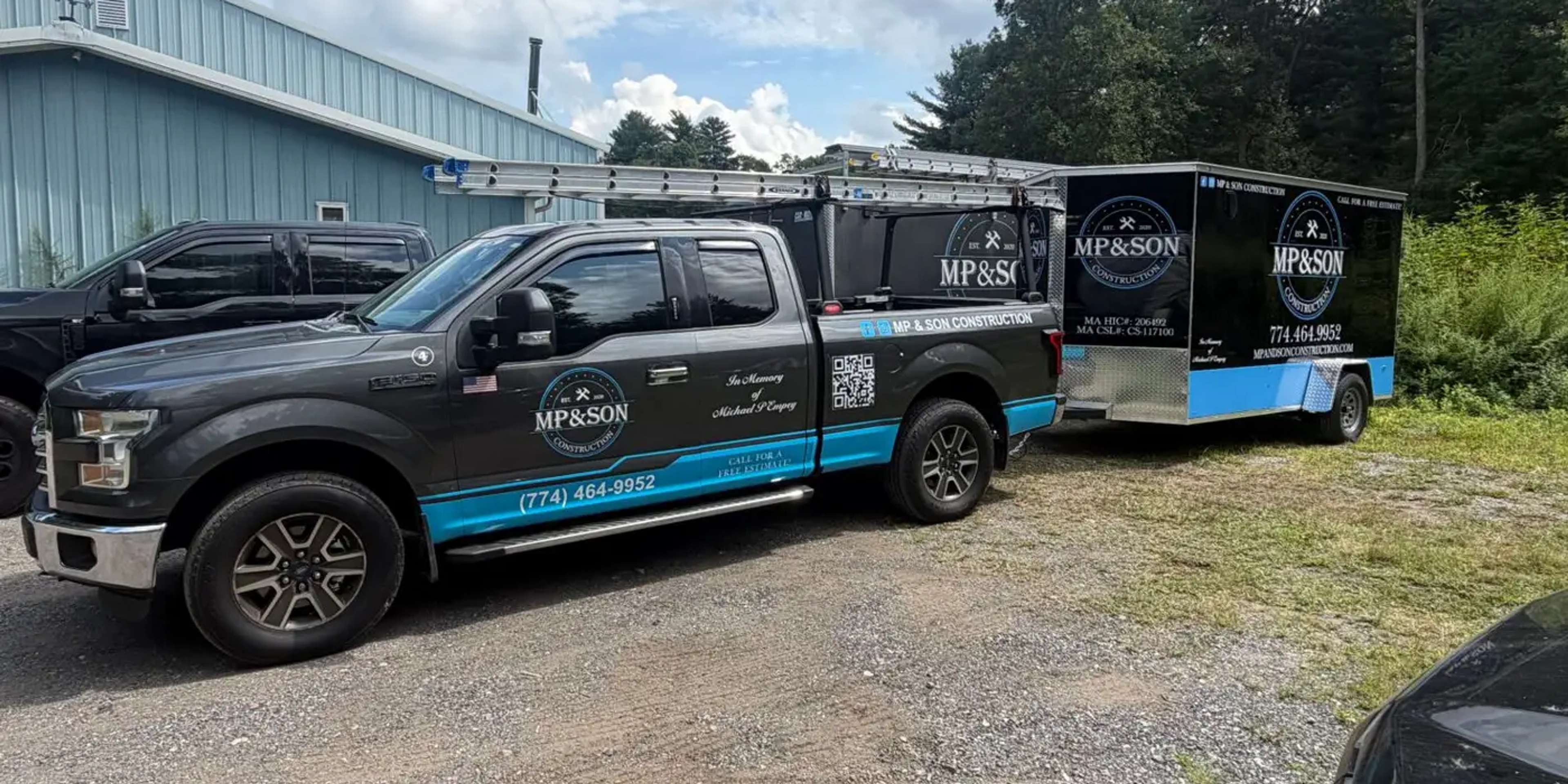 MP & Son Construction pickup and enclosed trailer wrapped in the company's black and blue branding