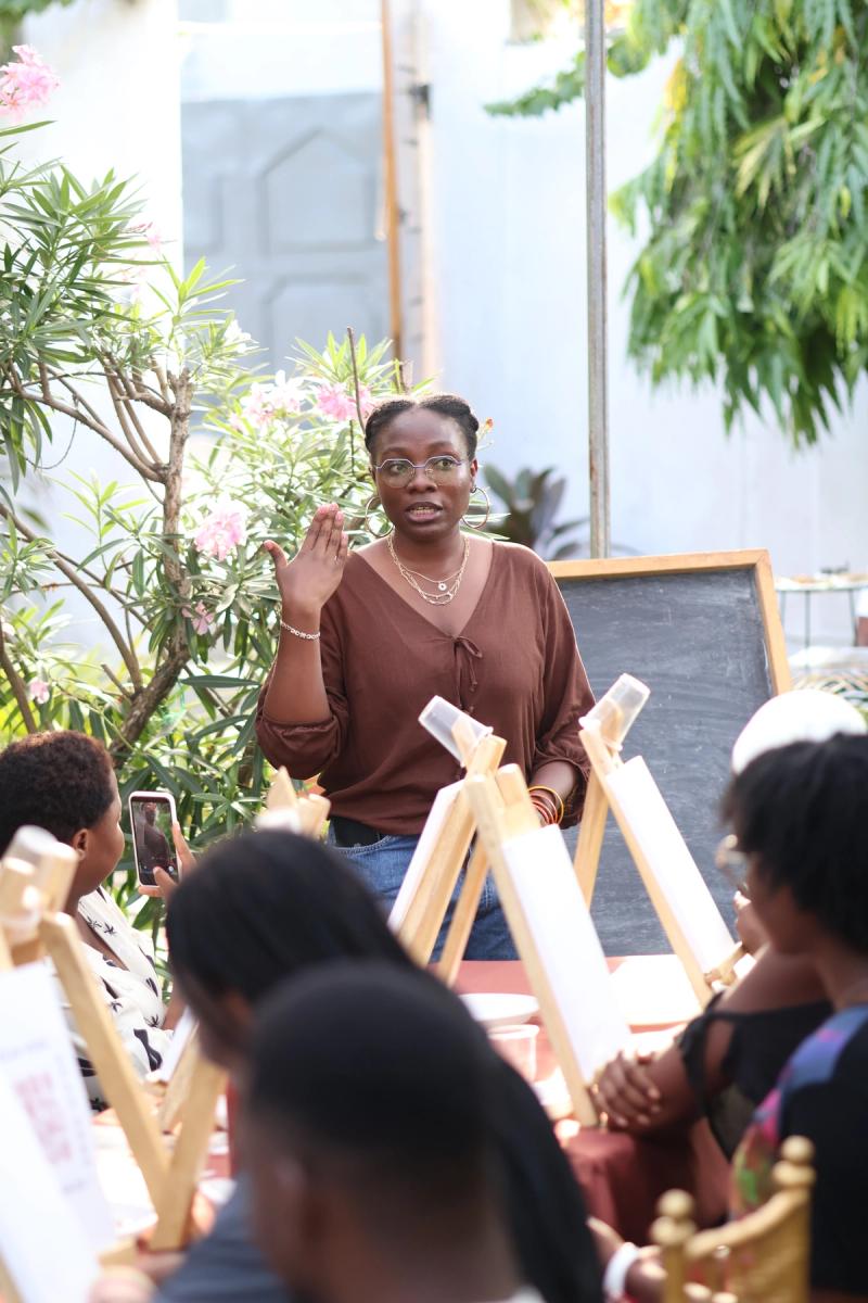 Emyloia, stanbding at the Book Club talking