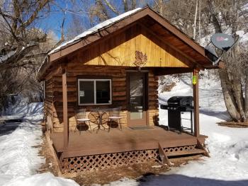 Outside view of studio cabin surrounded by snow
