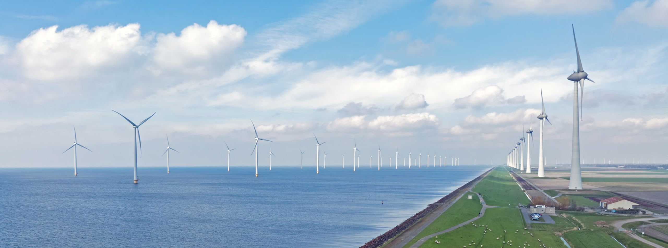 La transition énergétique aura aussi des répercussions territoriales. Éoliennes sur la digue près d'Urk, aux Pays-Bas (Keystone SDA).