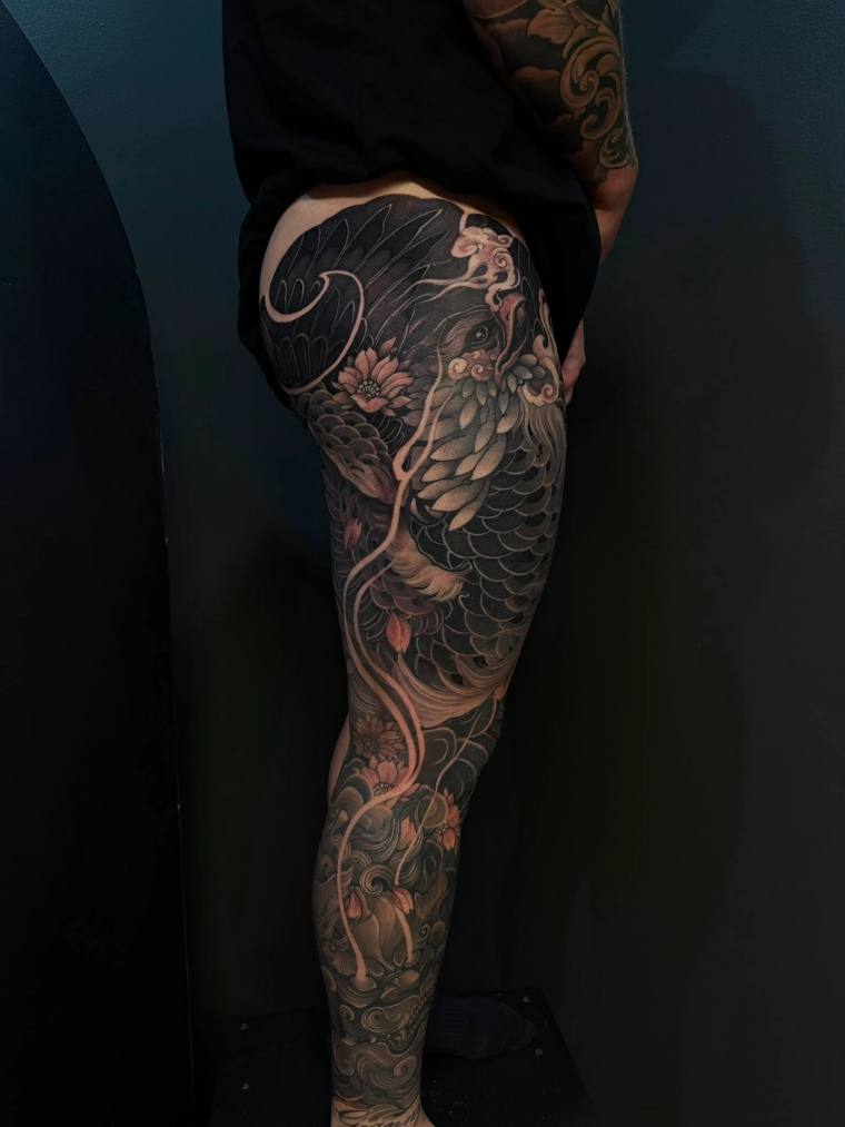 Oriental leg sleeve with phoenix and foo dog.
