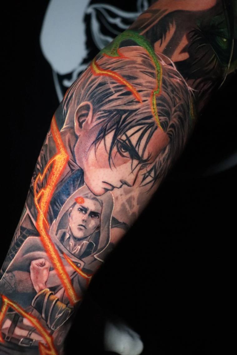 Finished color anime-style tattoo on a forearm depicting two manga characters with a ninja headband, wrapped in glowing orang