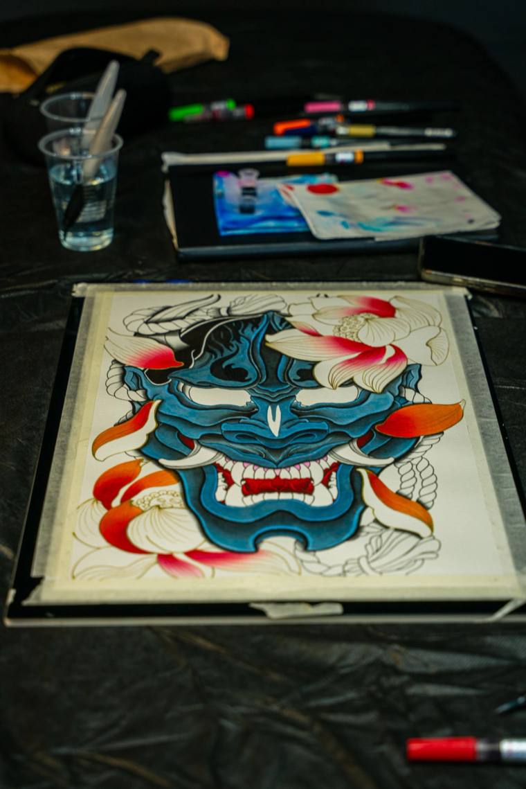Hannya flash, studio view, traditional Japanese demon mask in blue and lotus. by Steve