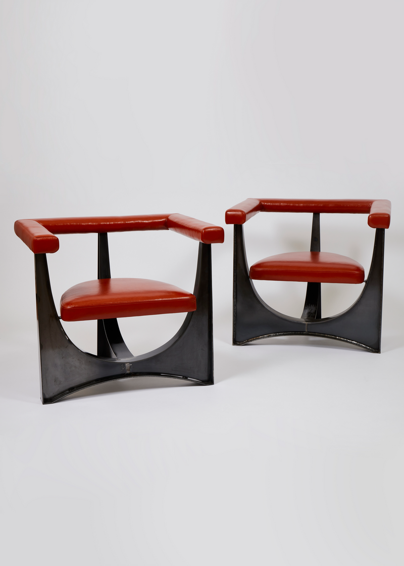 A pair of Brutalist steel base chairs in the manner of Paul Evans