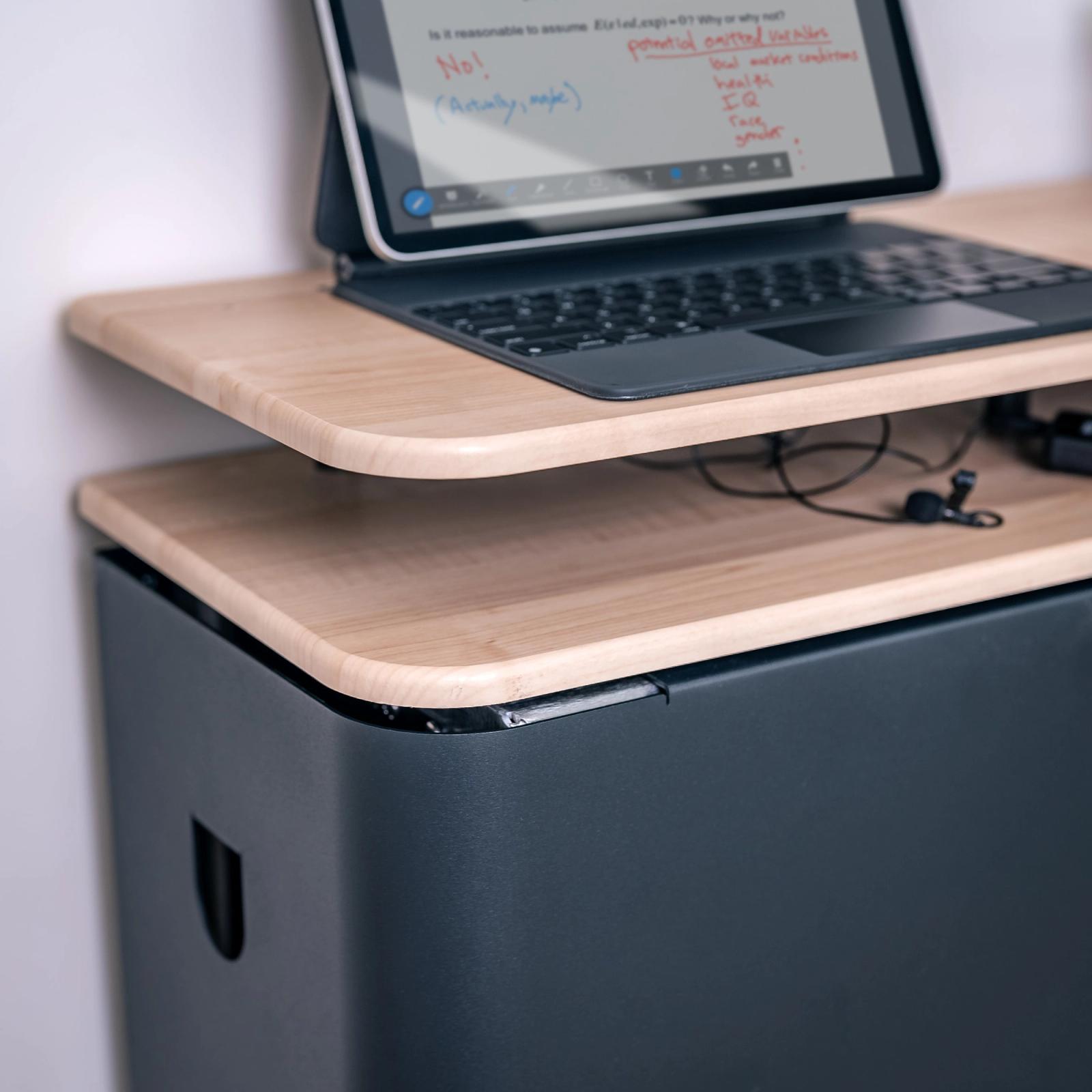 Space for your notebook, room controller, and mics.