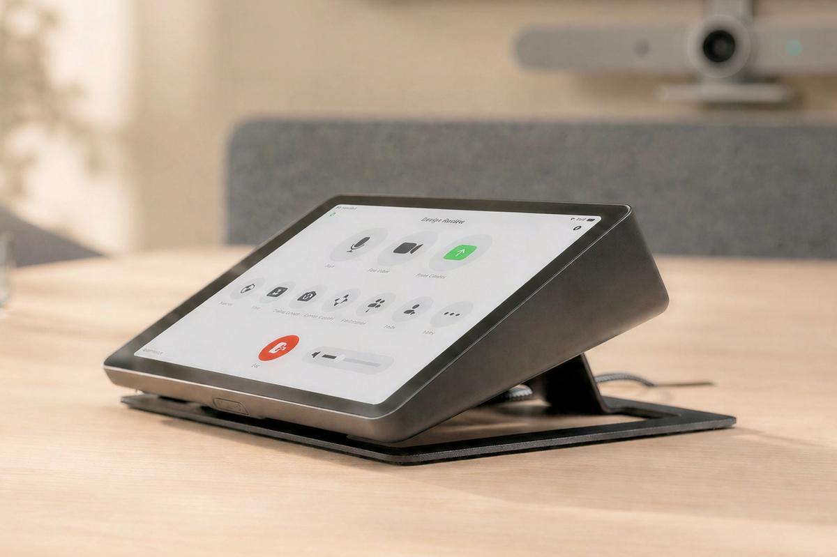 Meeting room controller and collaboration hardware in a shared room.