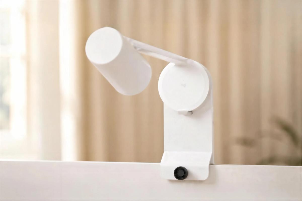 White whiteboard-capture camera on a Heckler arm mount clamped to the top edge of a whiteboard.