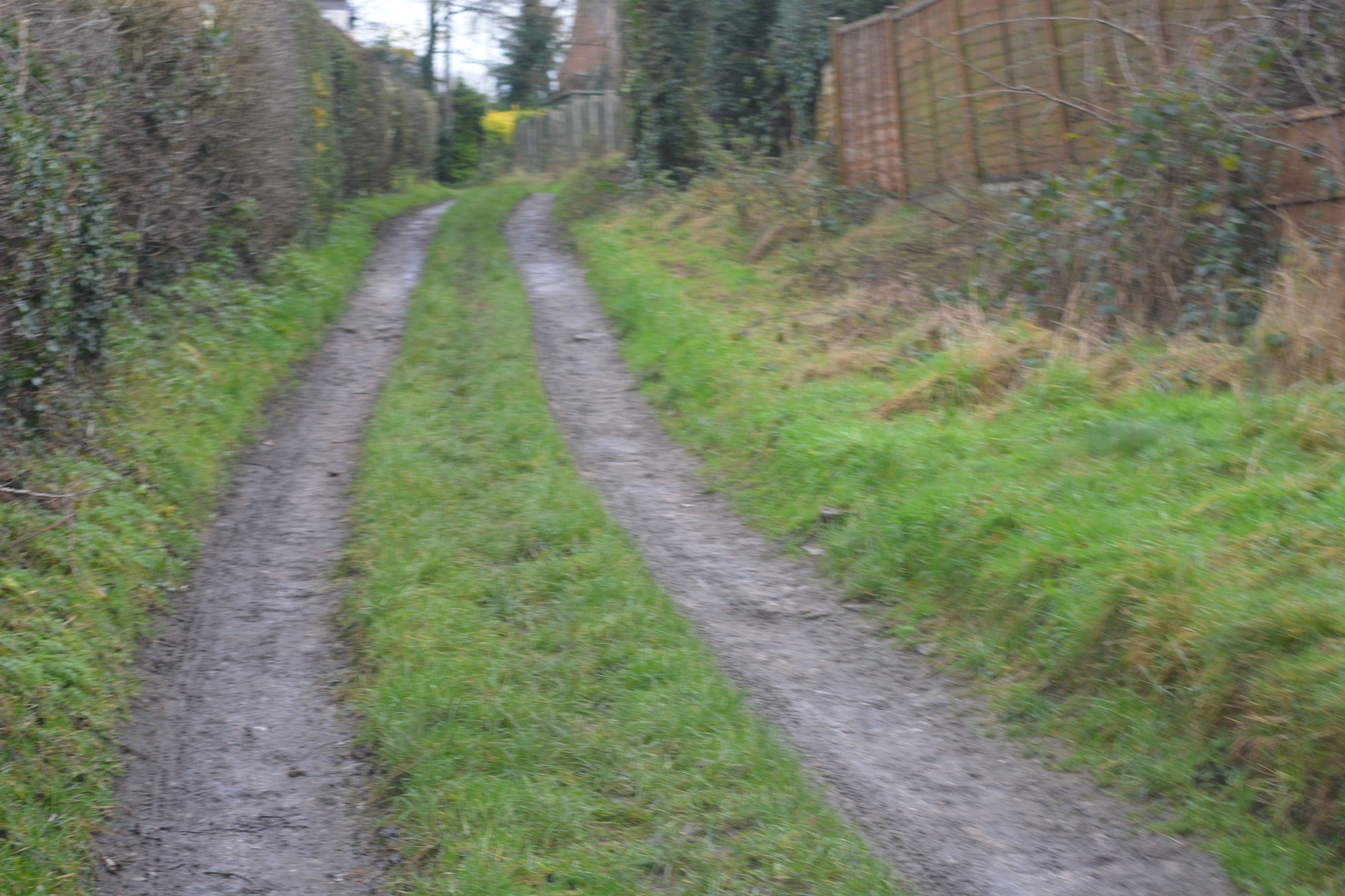 Turns to a tracked farm lane on to Chevin Road