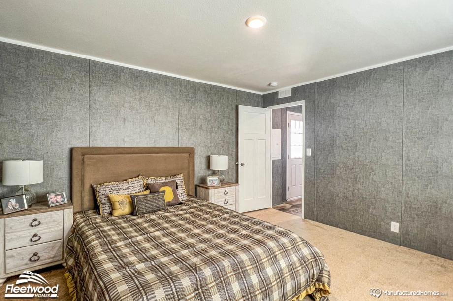 Mid-sized bedroom with two bedside tables.
