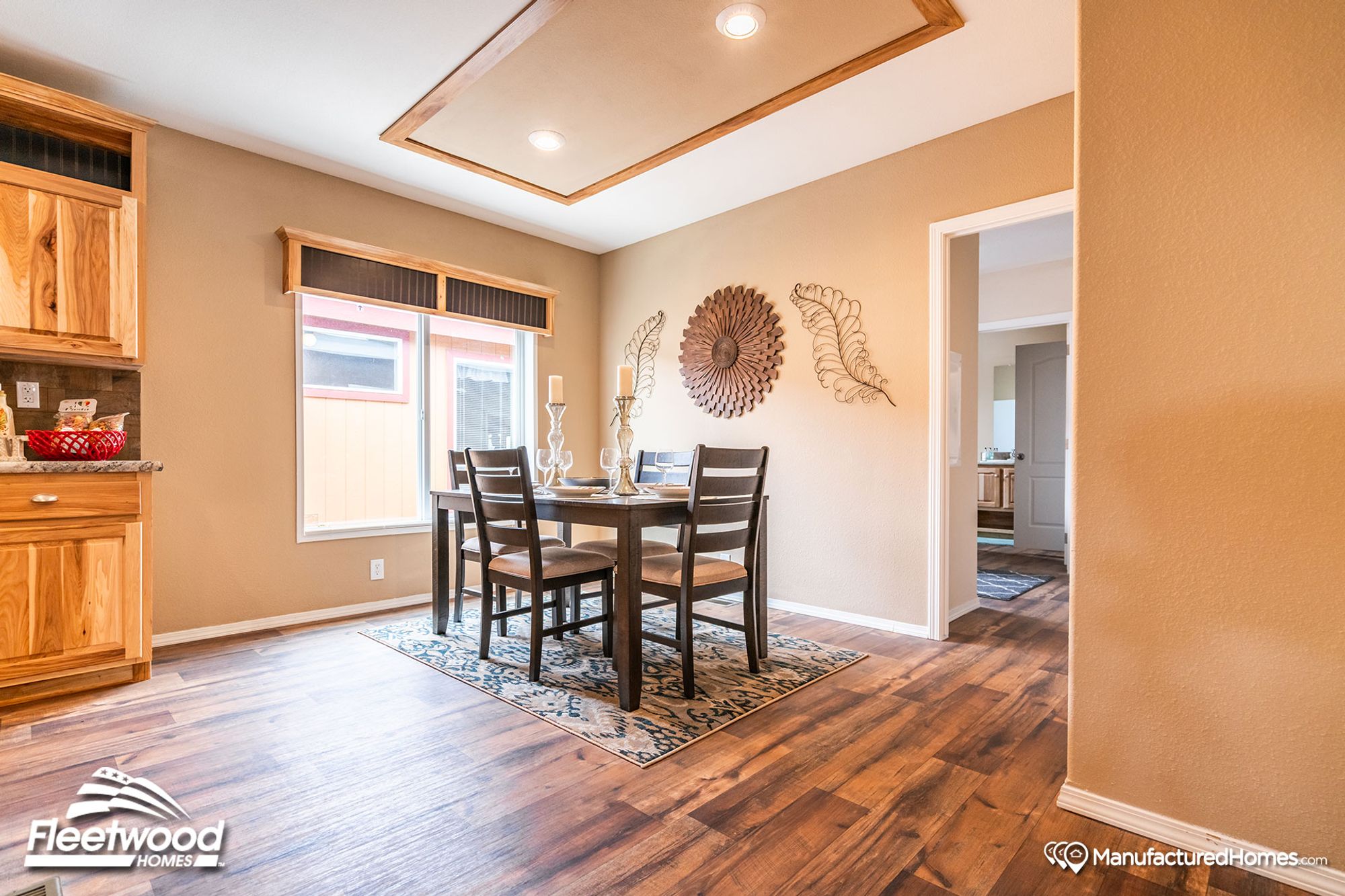 Large dining room with open access to the kitchen and a table that seats 4.