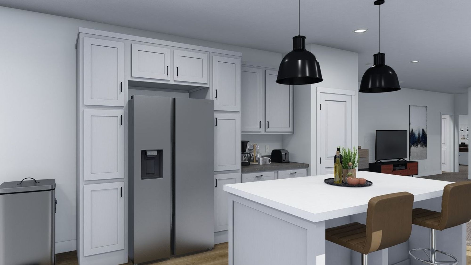 Medium-sized kitchen with white cabinetry, silver appliances, and an island.