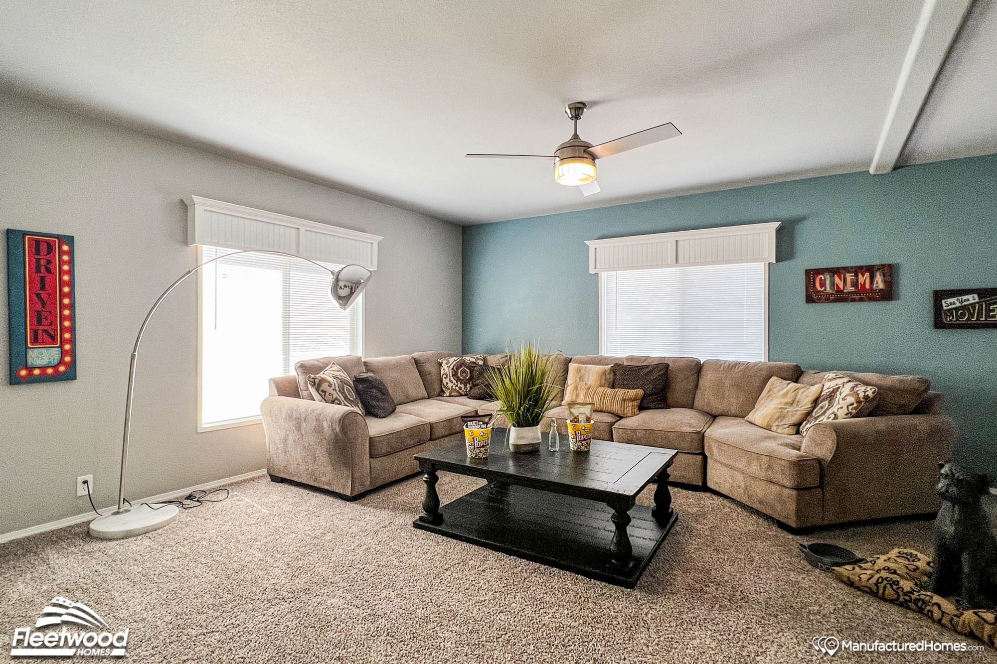 Large living room with an oversized couch and a coffee table.
