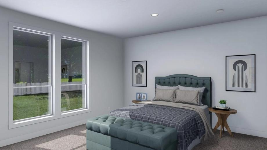 Large bedroom with a dresser, a large bed, and two end tables.