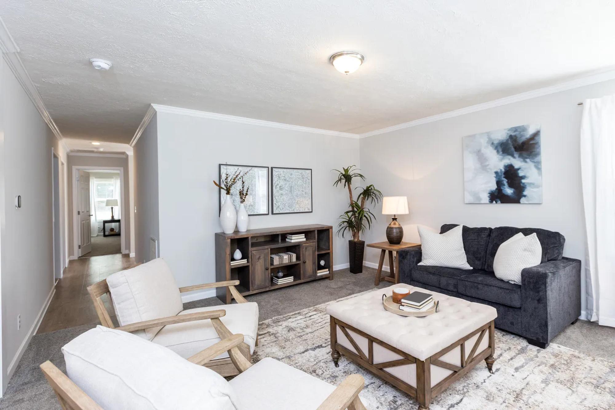 Medium-sized living room with a loveseat and two chairs