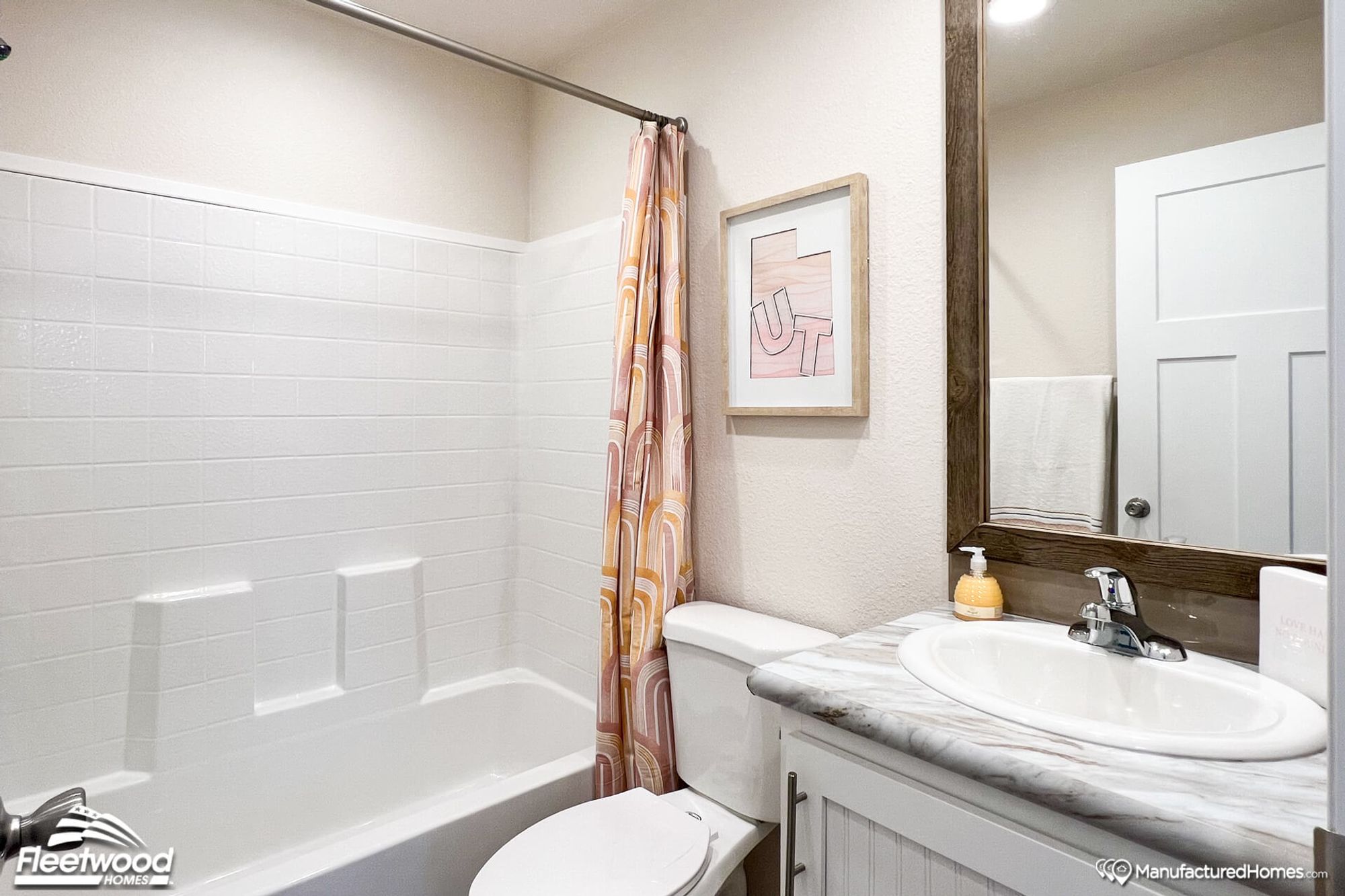 Small bathroom with a single sink and a bathtub-shower combo.