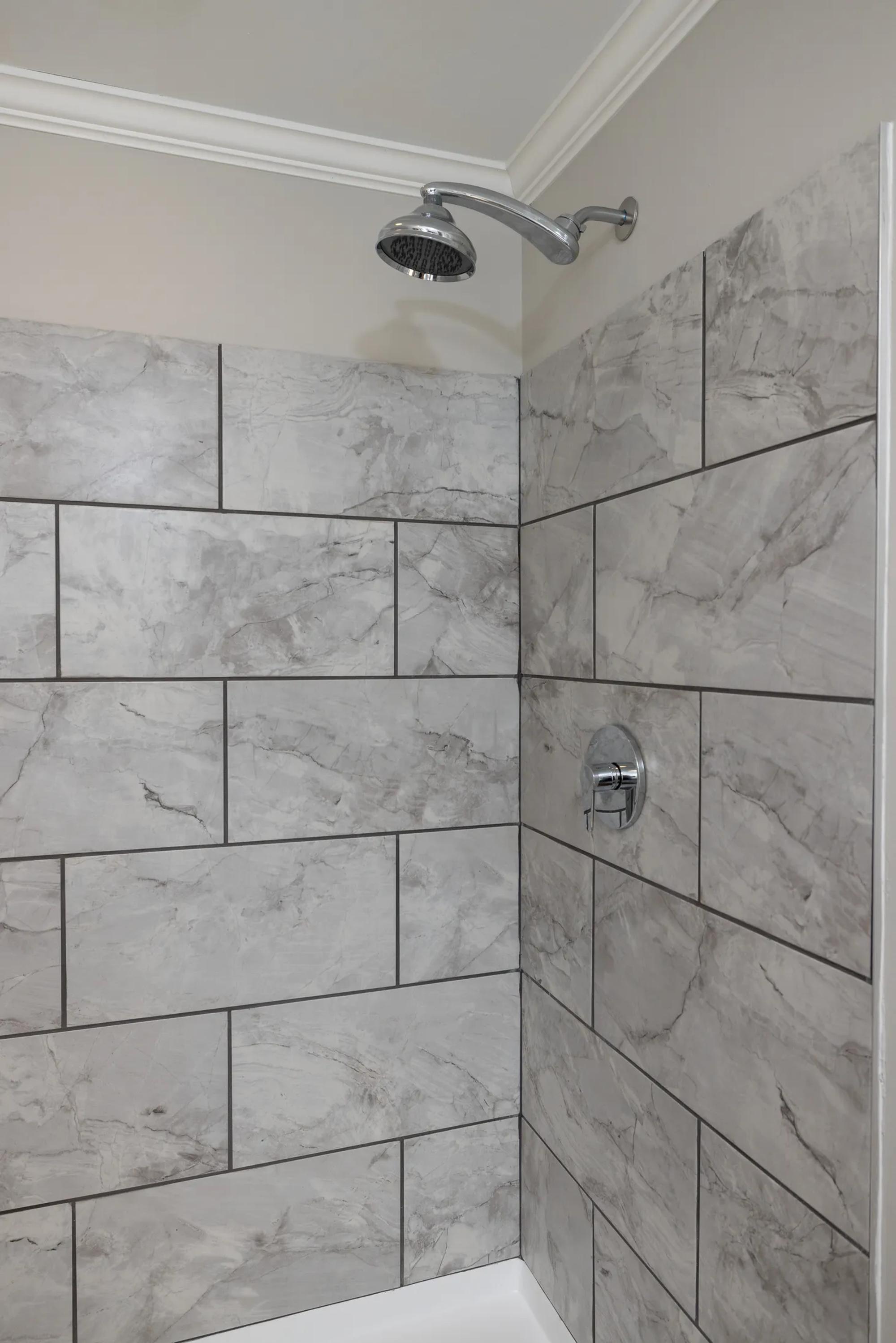 Shower with marble textured walls