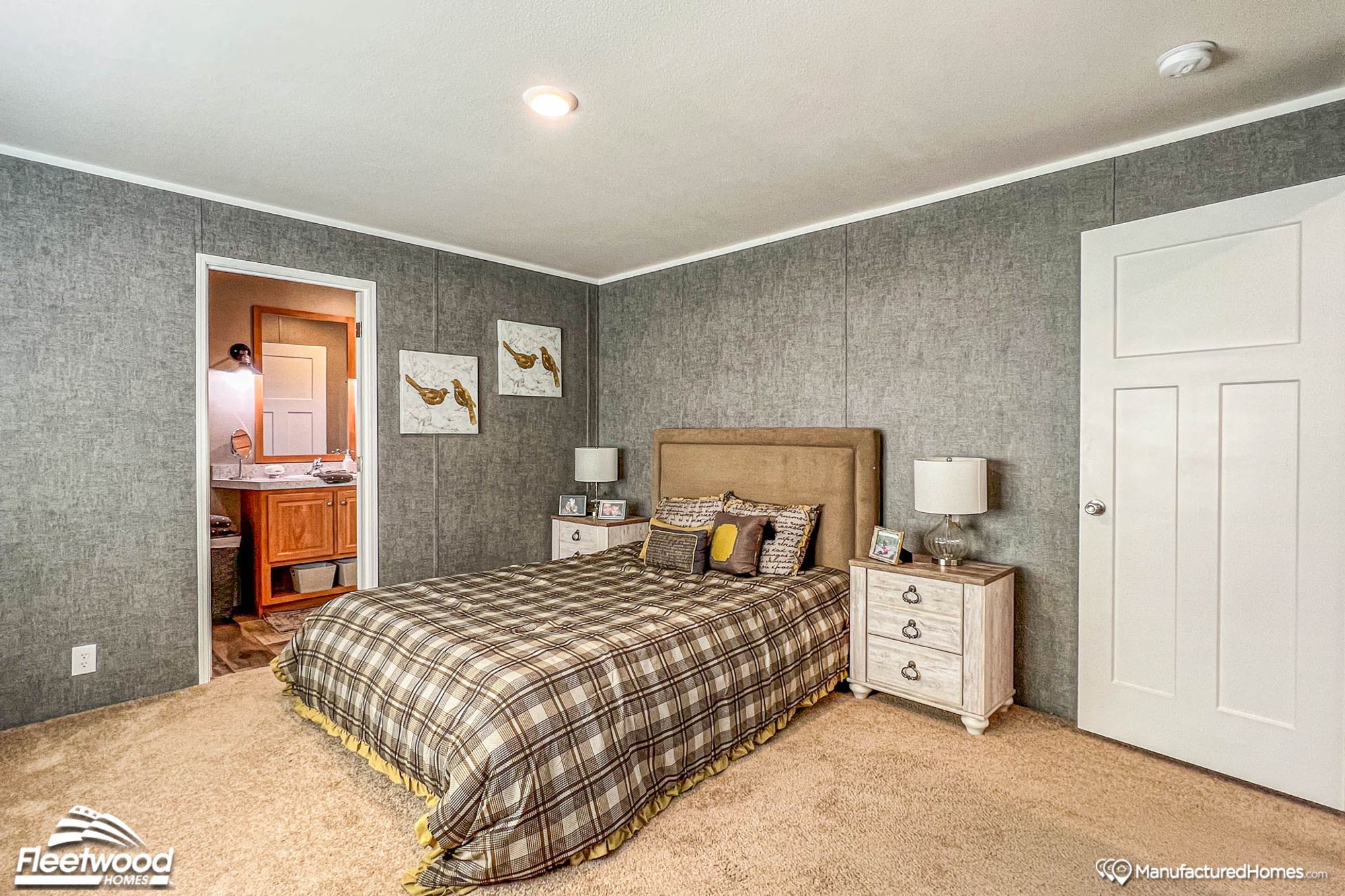 Mid-sized bedroom with two bedside tables.