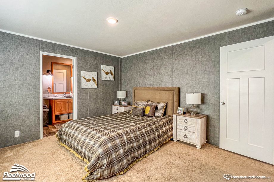 Mid-sized bedroom with two bedside tables.