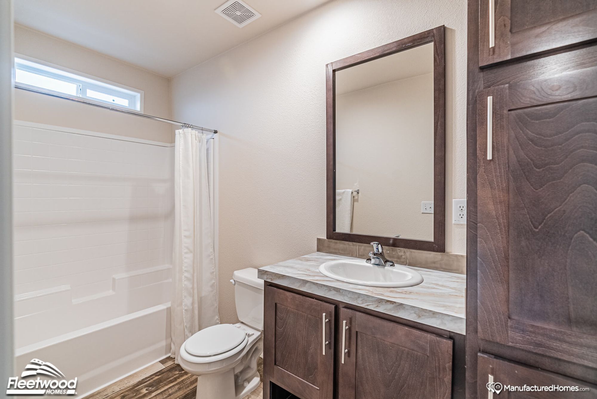 Small bathroom with a single sink and a bathtub-shower combo.