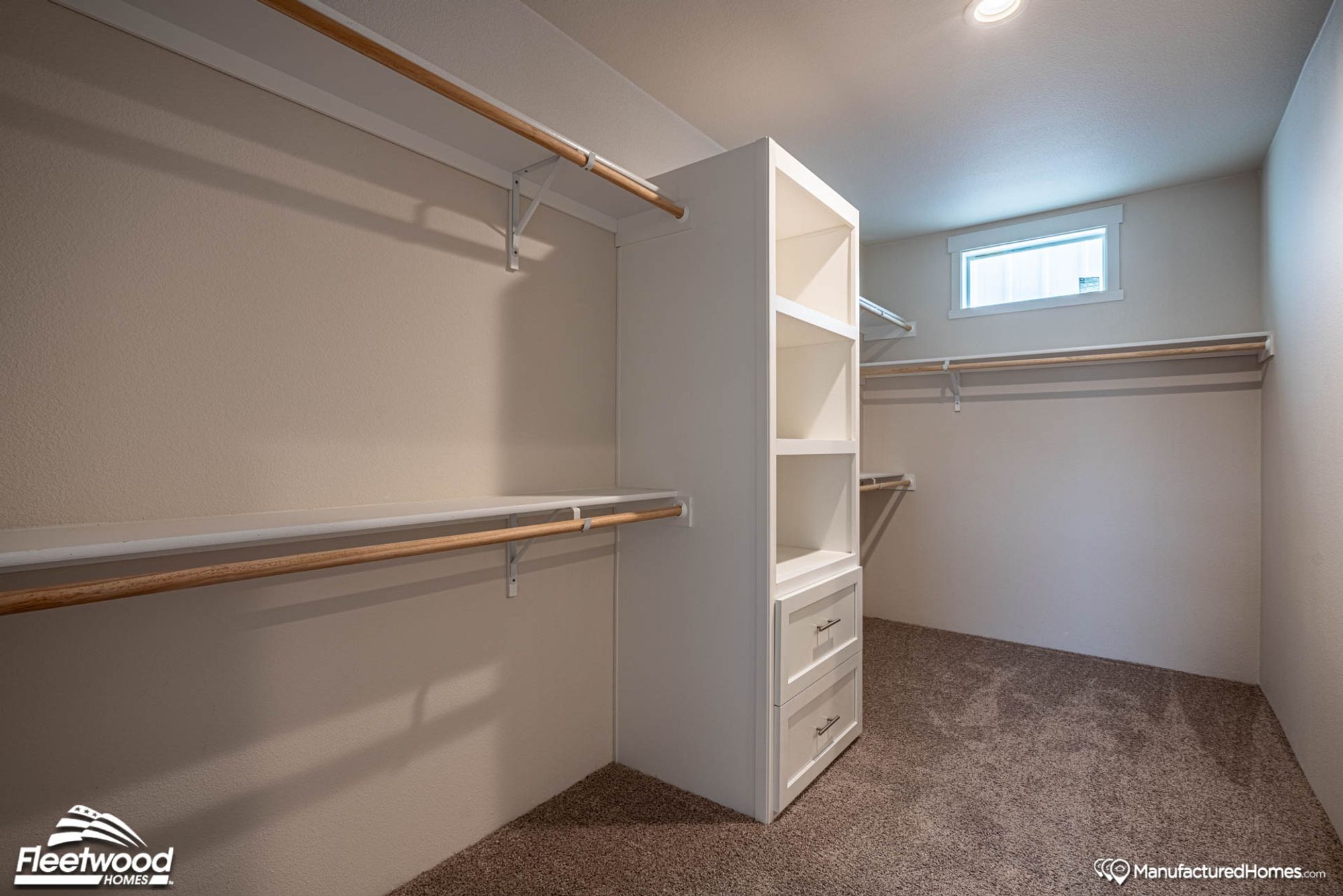 Large walk-in closet with a built-in wardrobe.