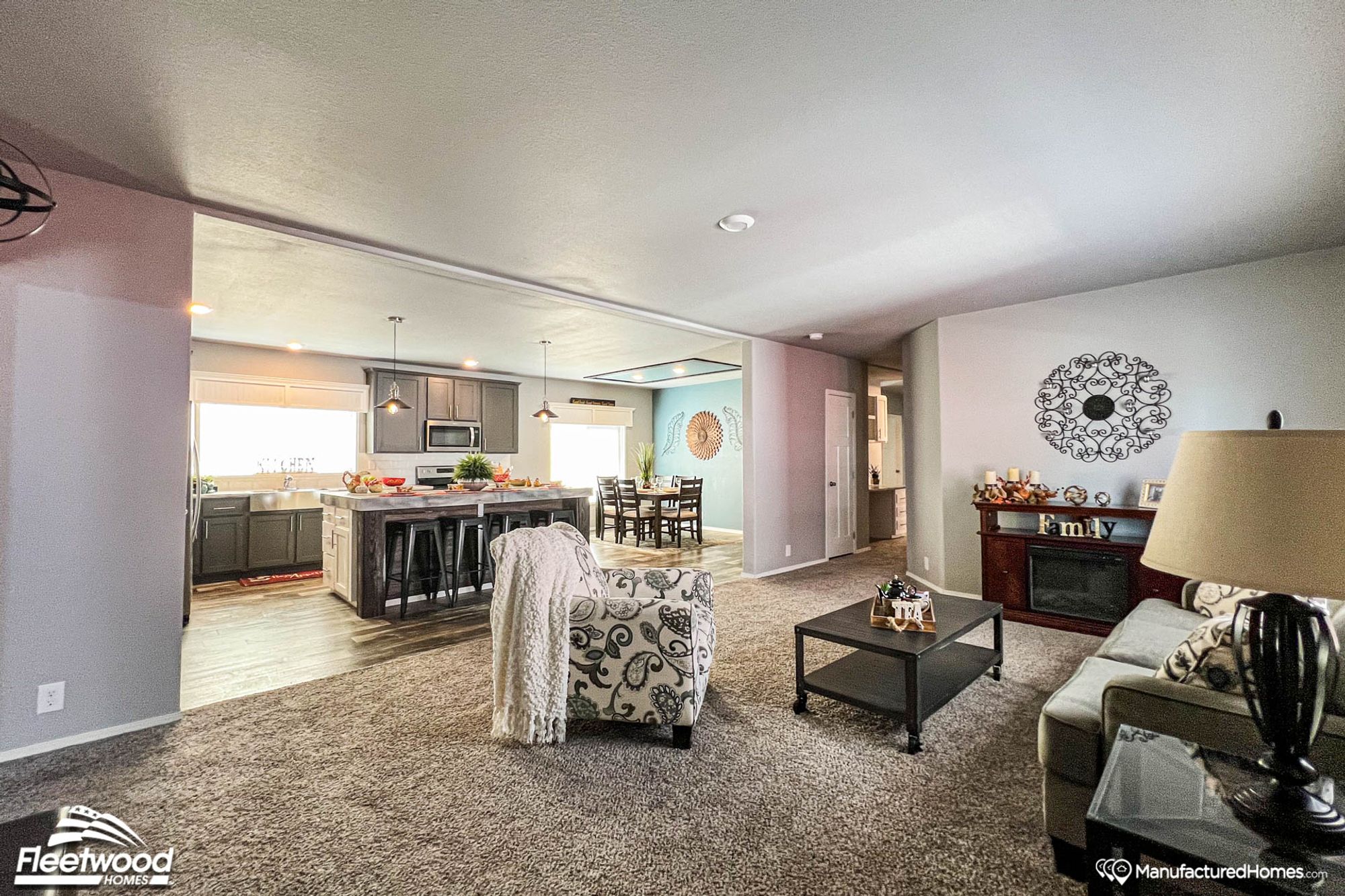 Open-concept front room, kitchen, and dining room.