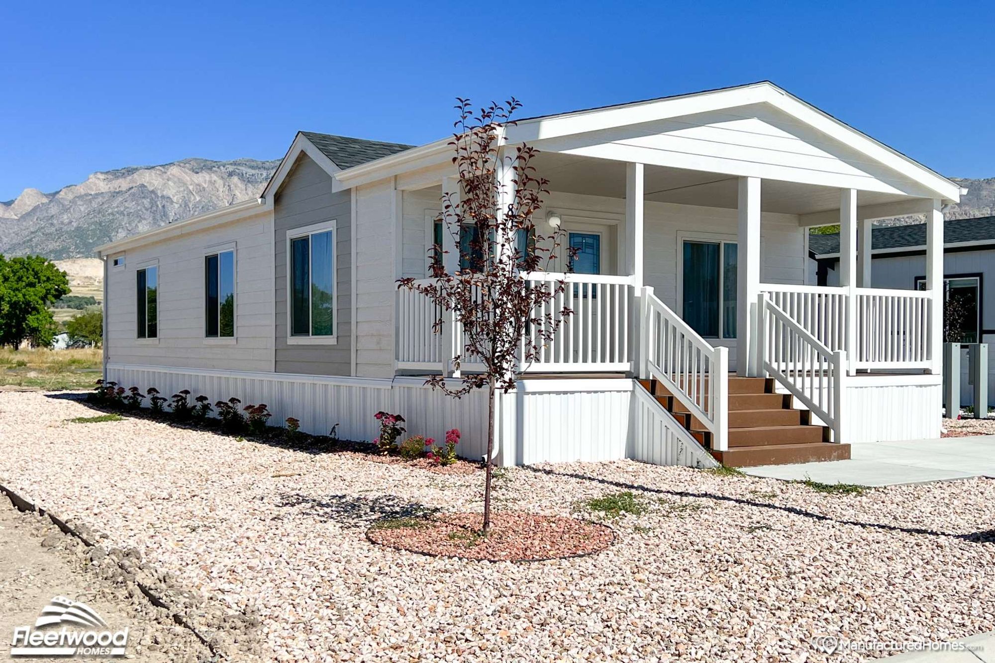 One-story white house with a covered front porch.