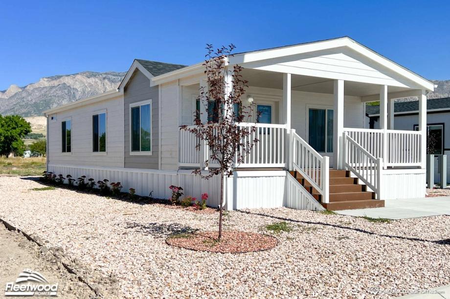 One-story white house with a covered front porch.