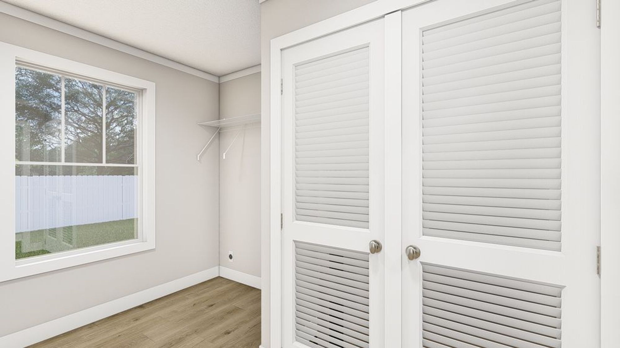 White empty room with a medium sized closet